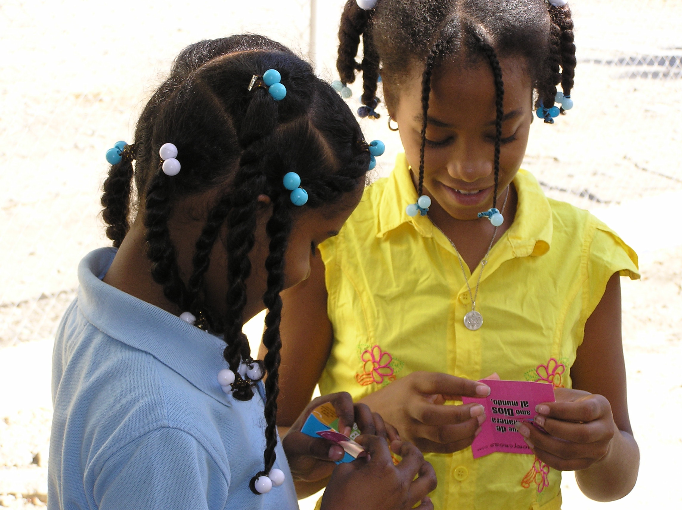 Children using a Memory Cross Bible card